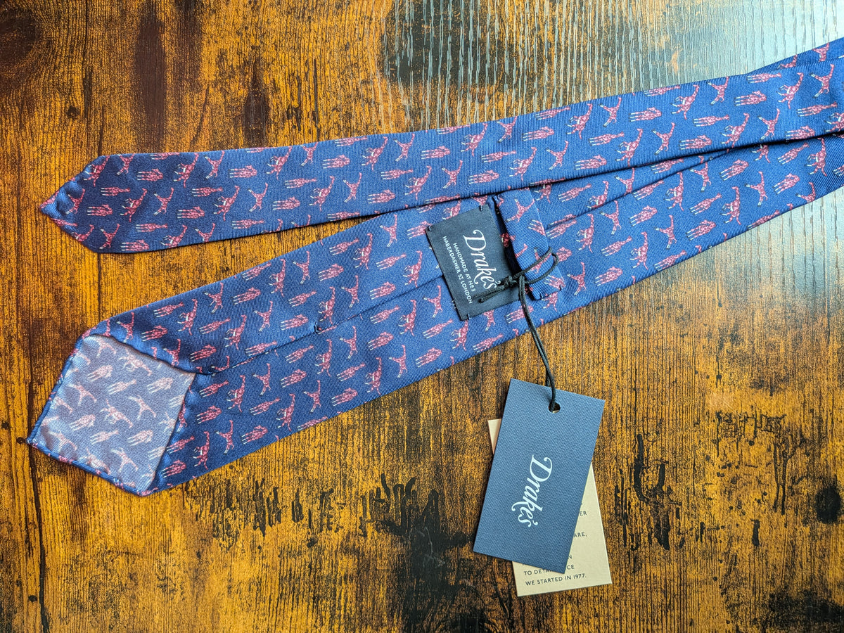 Drake's blue pink giraffe handmade tipped silk tie detail view 2