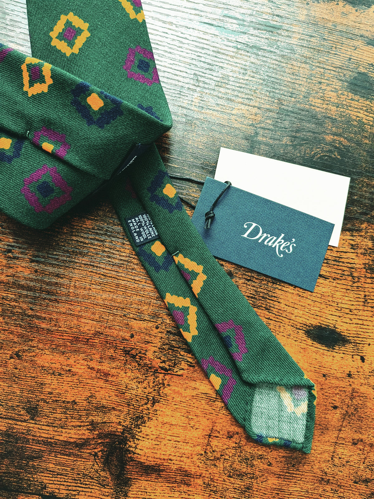 Drake's dark green geometric handmade silk tie detail view 3