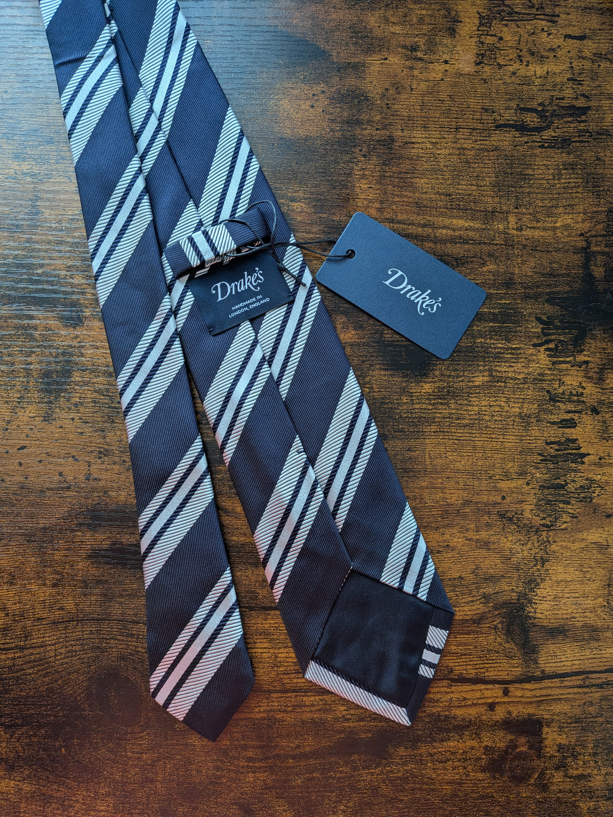 Drake's dark navy white handmade striped silk tie detail view 3
