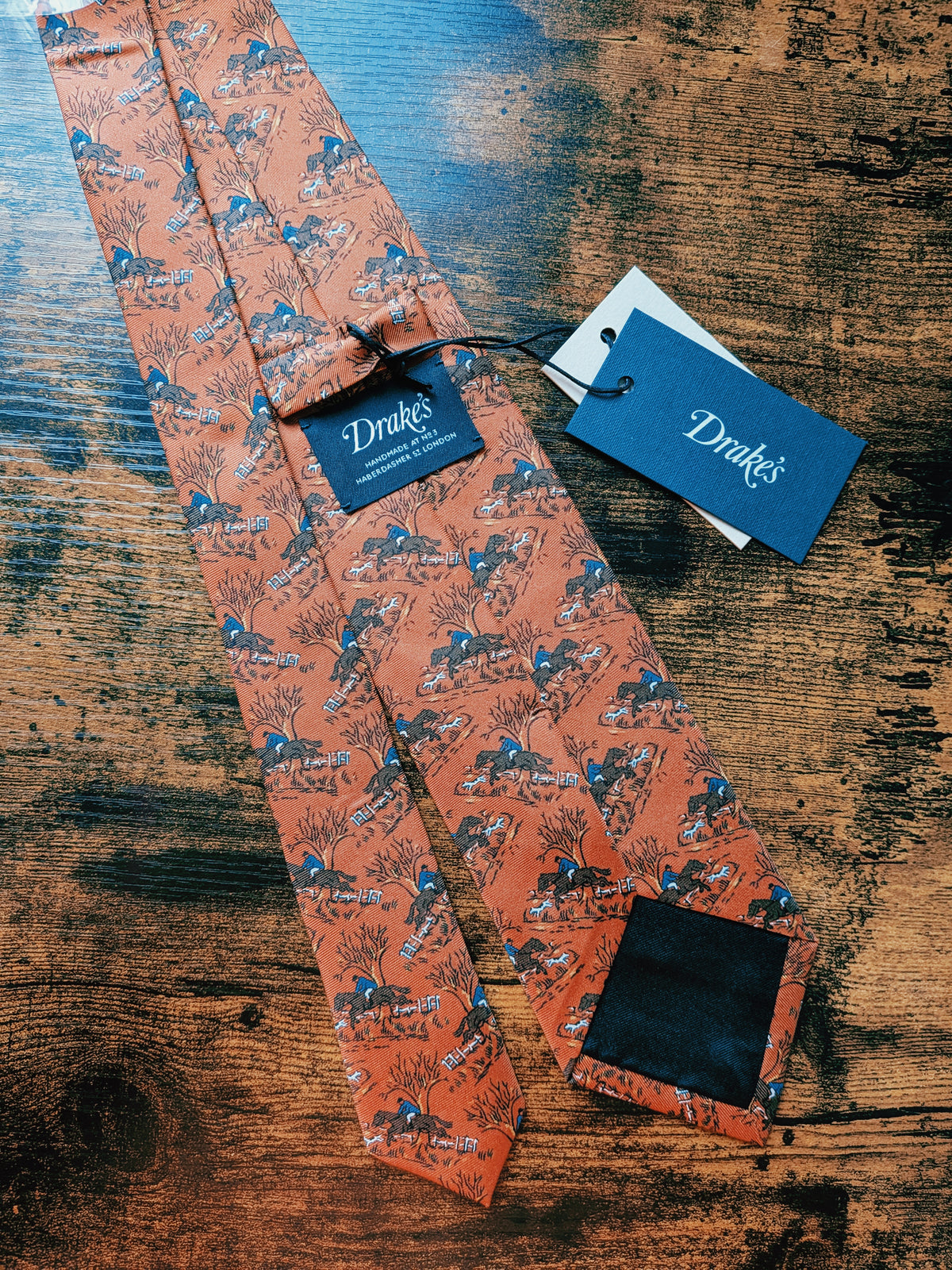 Drake's horse riding orange handmade tipped silk tie detail view 3
