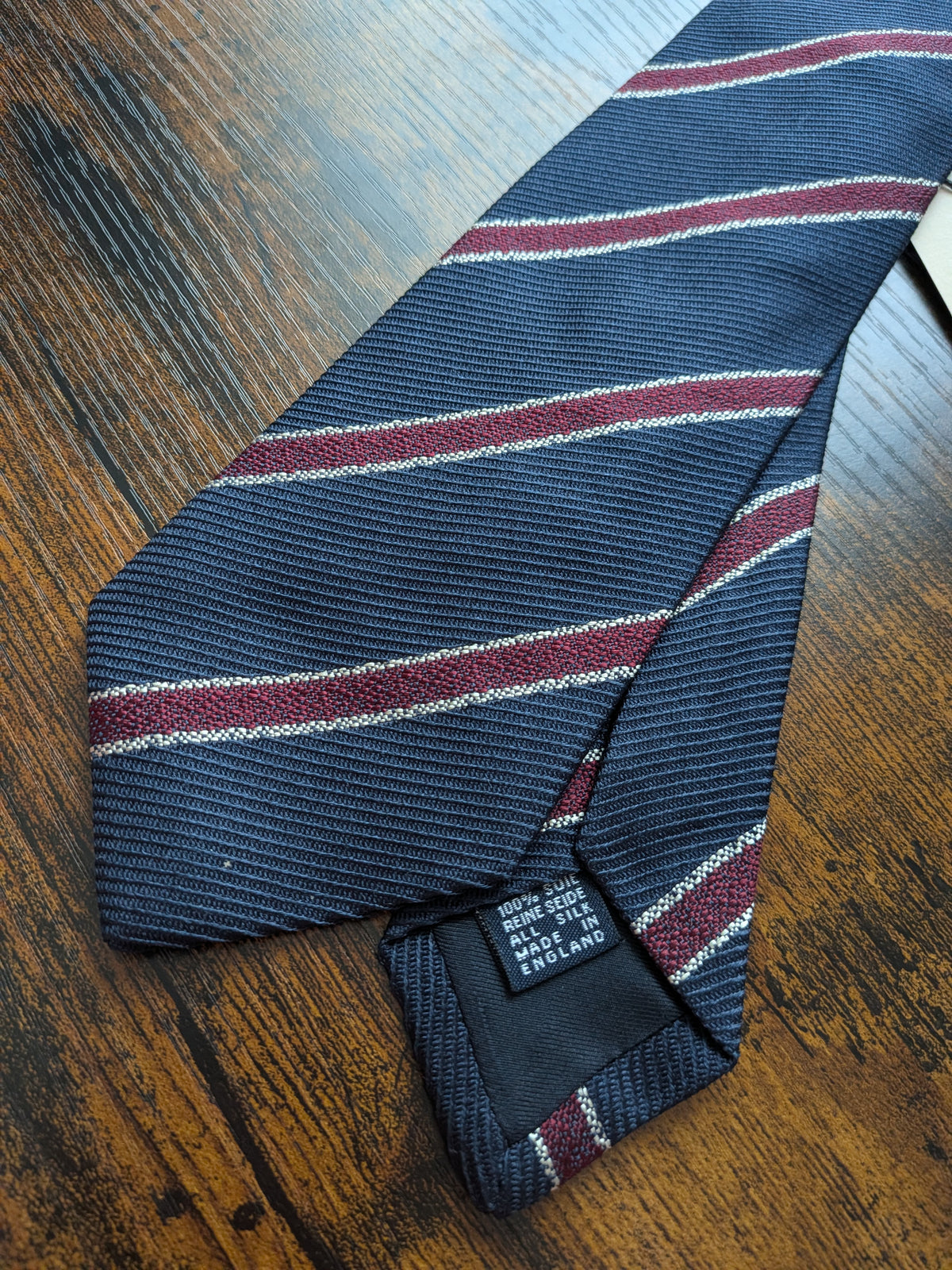 Drake's navy burgundy white handmade striped silk tie detail view 3