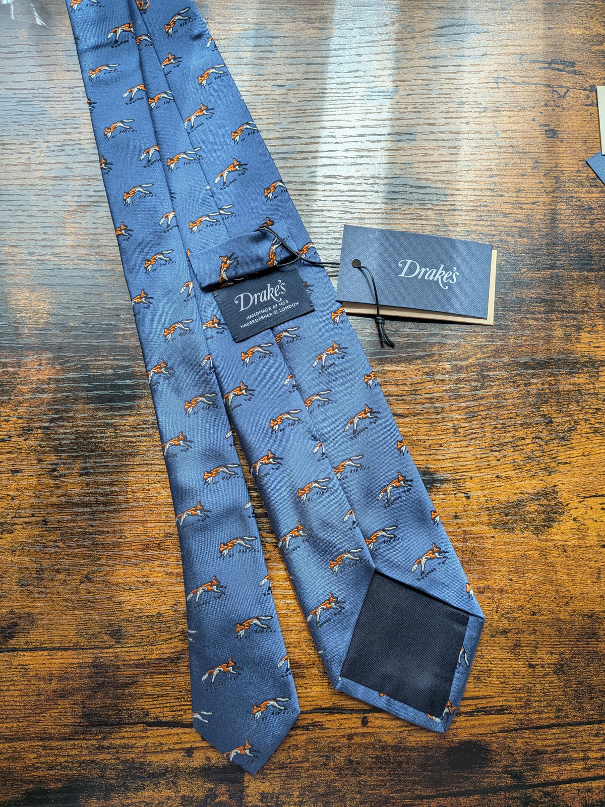 Drake's blue fox motif handmade silk tie detail view 2