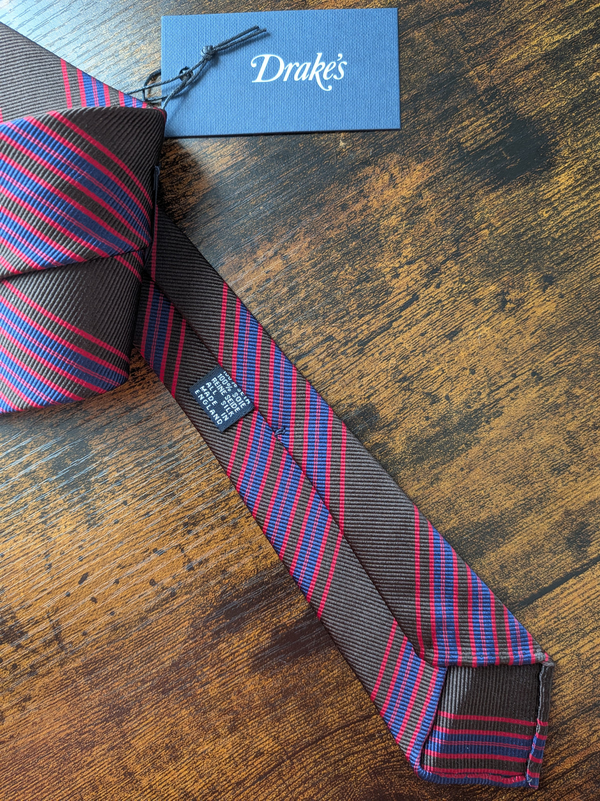 Drake's brown red blue handmade striped silk tie detail view 2