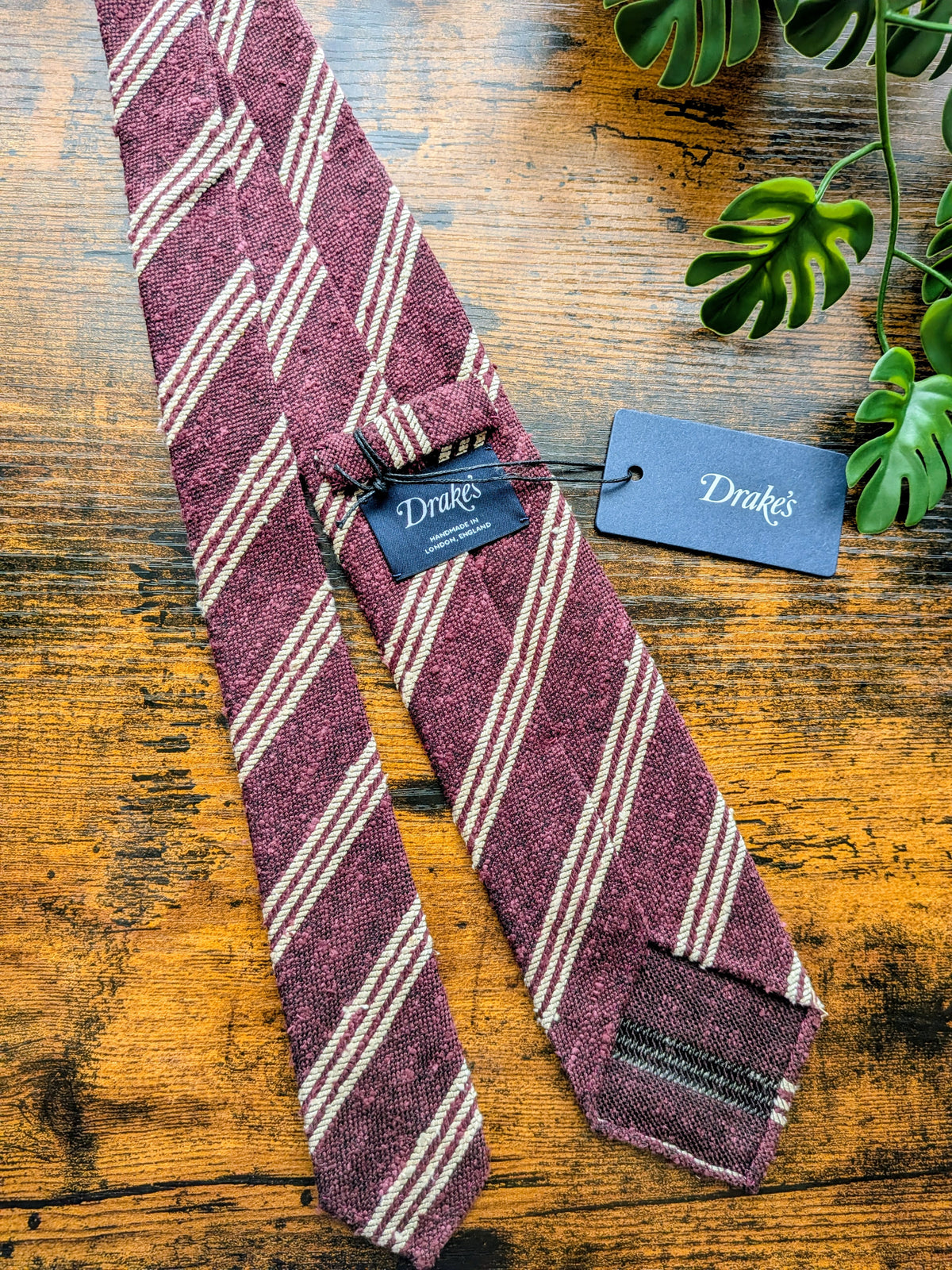 Drake's burgundy and white striped handmade tussah silk tie detail view 2