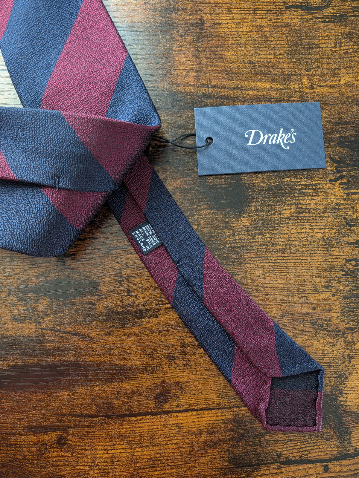 Drake's burgundy navy striped handmade silk tie detail view 2