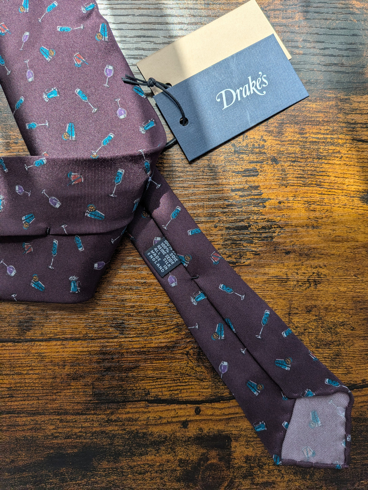 Drake's cocktail purple motif handmade silk tie detail view 2