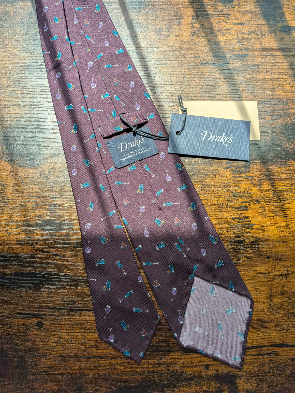Drake's cocktail purple motif handmade silk tie detail view 3
