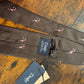 Drake's dark brown football motif handmade tipped silk tie detail view 4