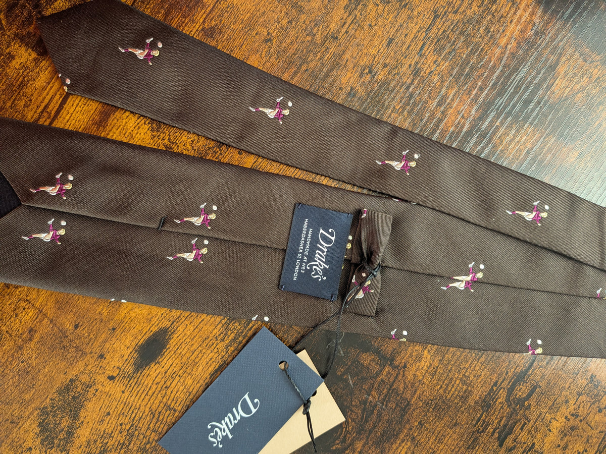 Drake's dark brown football motif handmade tipped silk tie detail view 4