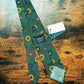 Drake's dark green geometric handmade silk tie detail view 2