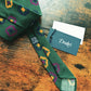 Drake's dark green geometric handmade silk tie detail view 3