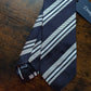 Drake's dark navy white handmade striped silk tie detail view 2