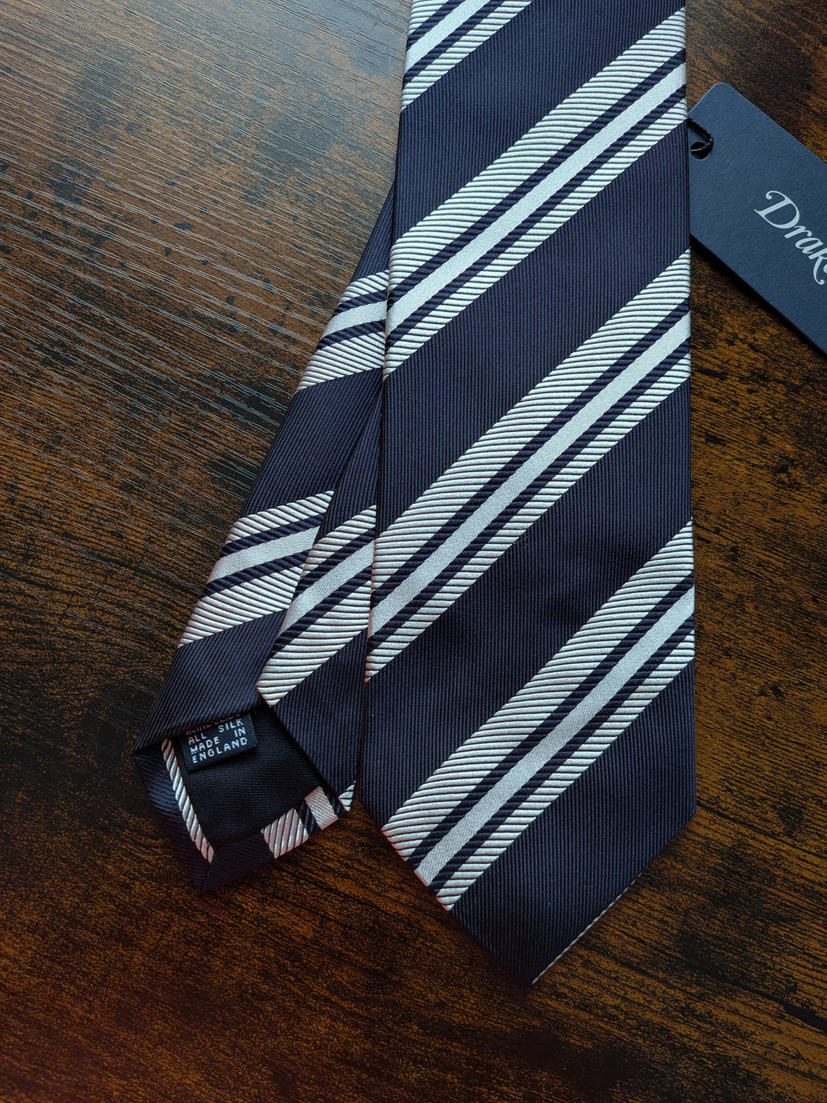 Drake's dark navy white handmade striped silk tie detail view 2