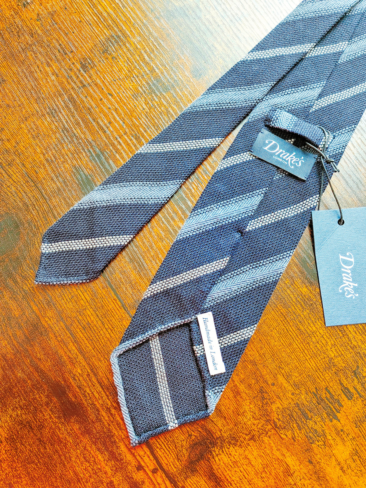 Drake's grenadine navy blue handmade striped silk tie detail view 3