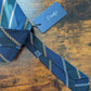Drake's grenadine navy green yellow multicoloured striped handmade silk tie detail view 2