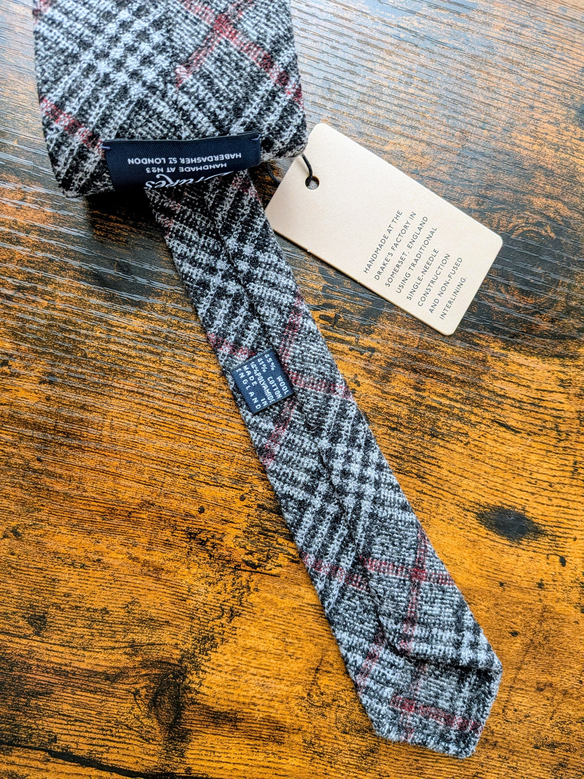 Drake's grey red check handmade silk tie detail view 2