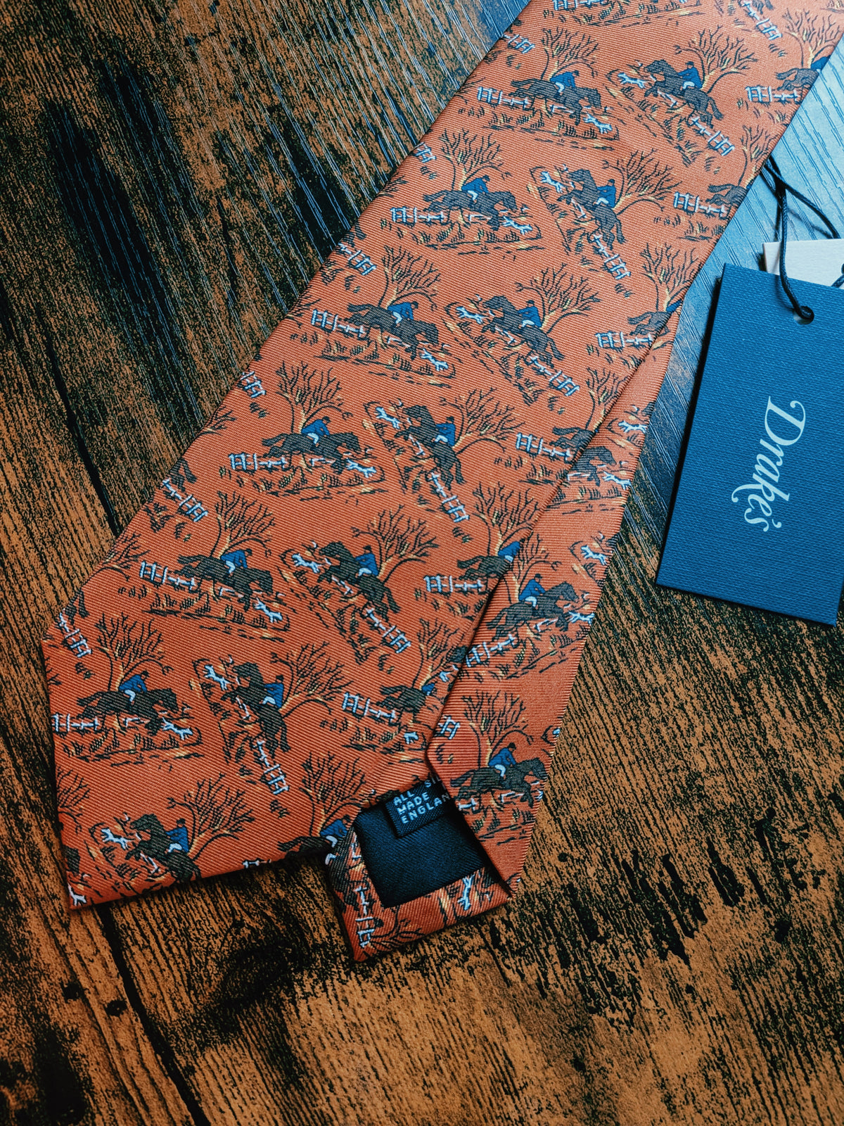 Drake's horse riding orange handmade tipped silk tie detail view 2