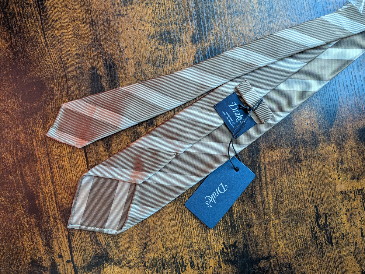 Drake's light brown handmade striped silk tie detail view 2