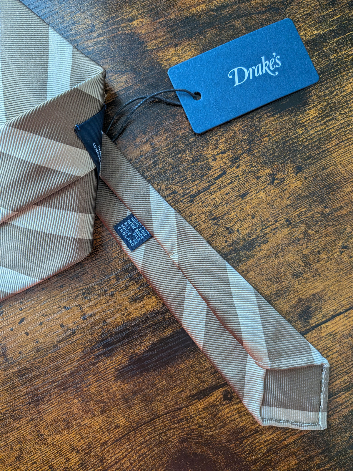 Drake's light brown handmade striped silk tie detail view 3