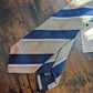 Drake's light brown navy white multicoloured striped handmade silk tie detail view 2