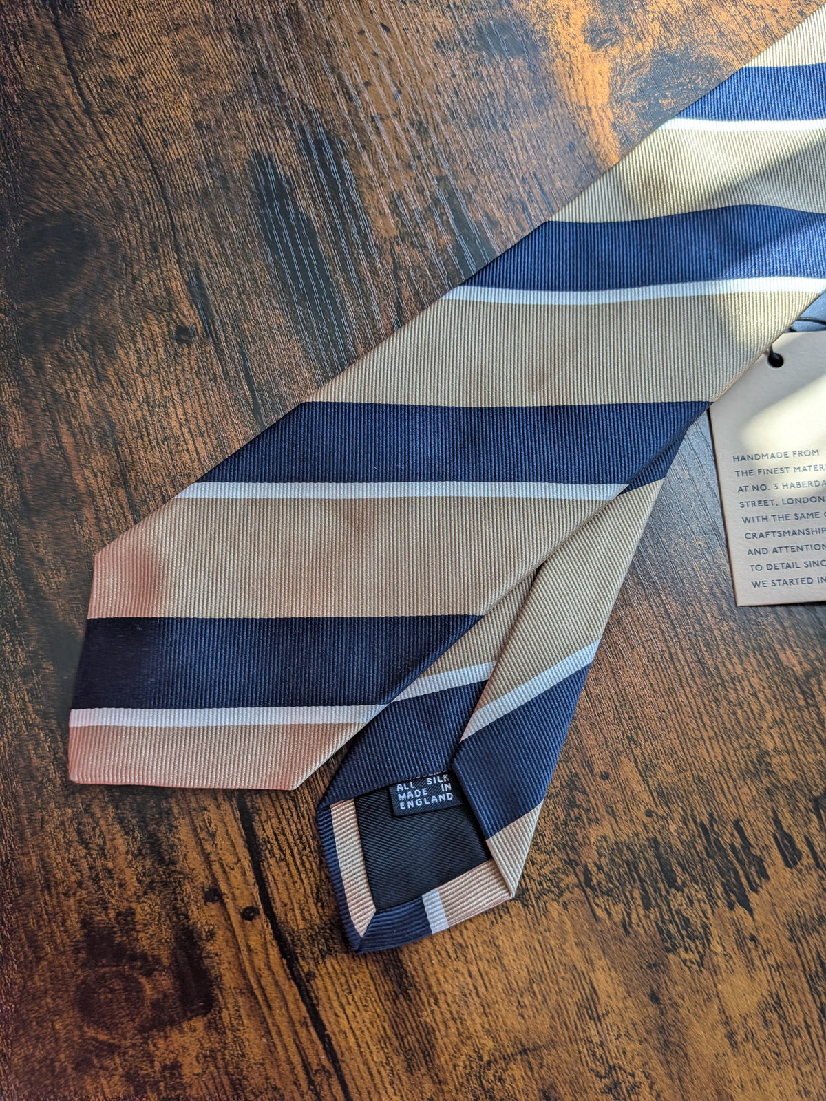 Drake's light brown navy white multicoloured striped handmade silk tie detail view 2