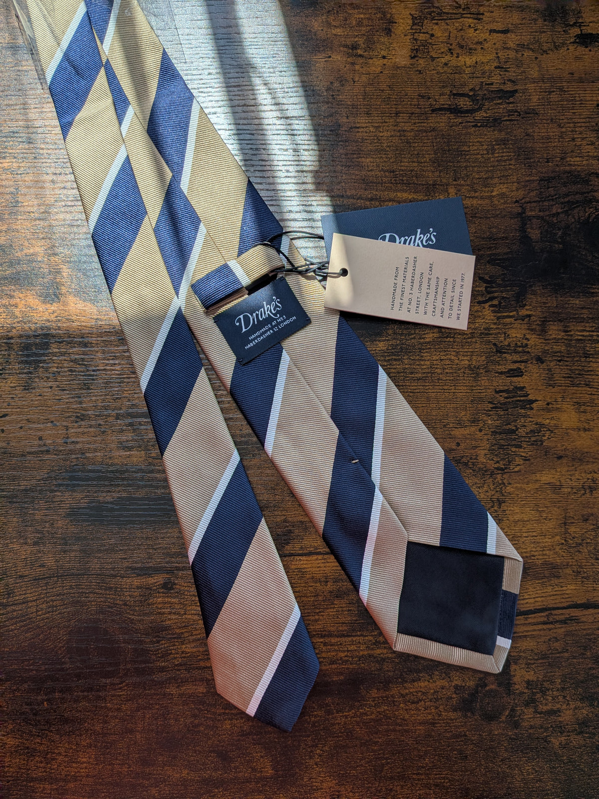 Drake's light brown navy white multicoloured striped handmade silk tie detail view 3