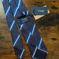 Drake's navy blue white striped handmade silk tie detail view 2