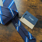Drake's navy blue white striped handmade silk tie detail view 3