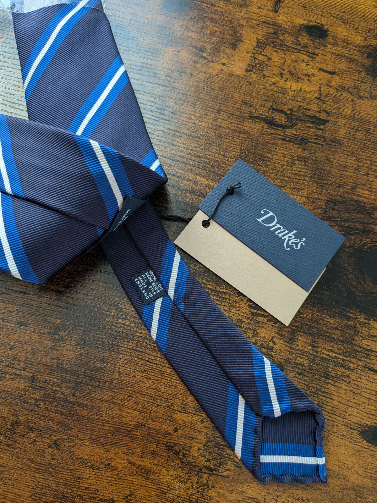 Drake's navy blue white striped handmade silk tie detail view 3