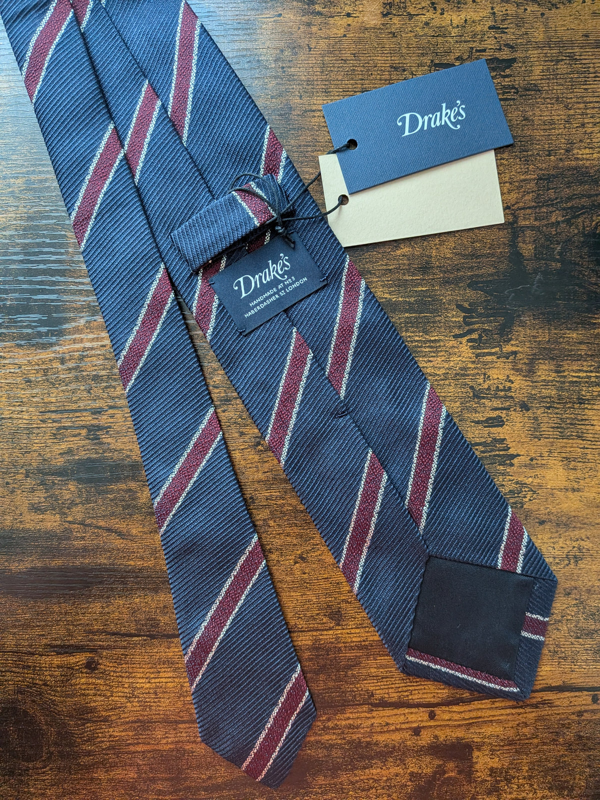 Drake's navy burgundy white handmade striped silk tie detail view 2