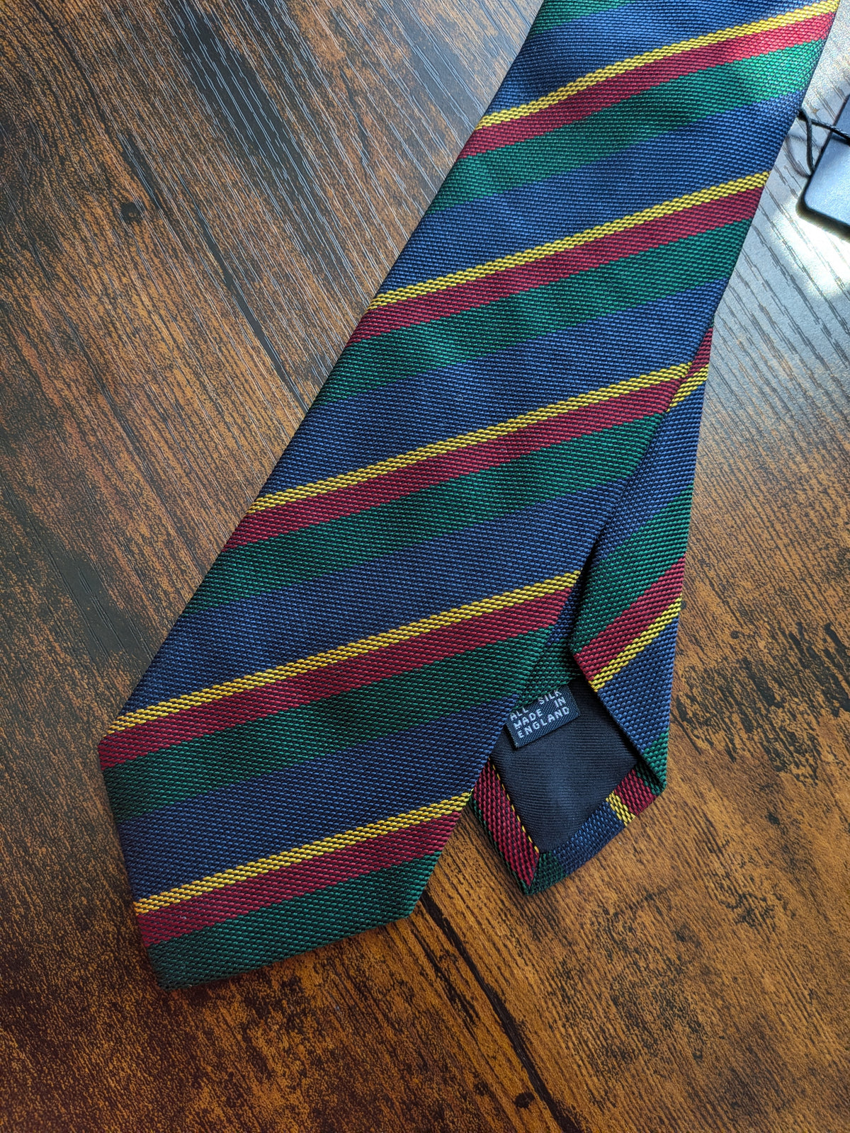Drake's navy green multicoloured striped handmade silk tie detail view 2