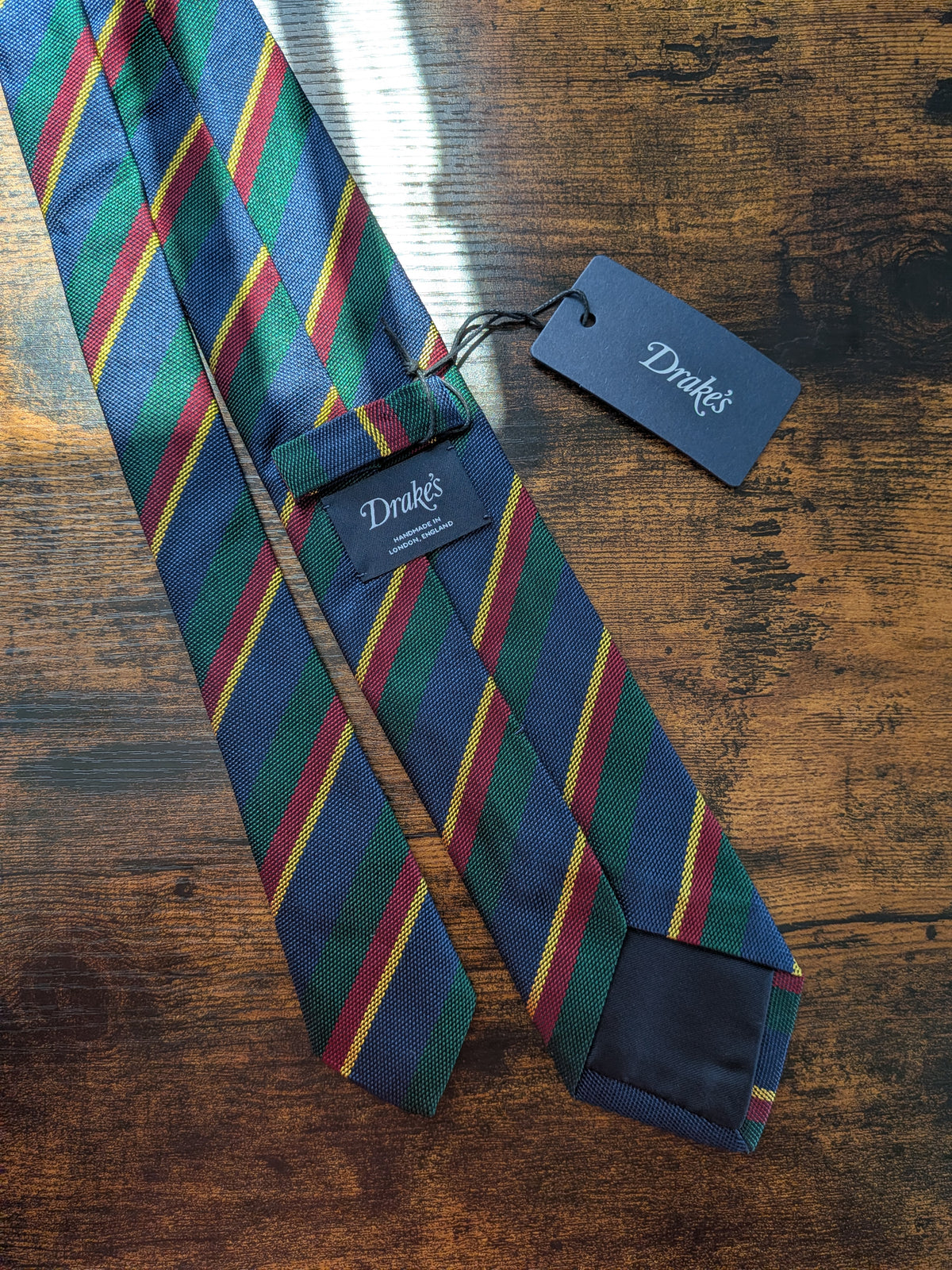 Drake's navy green multicoloured striped handmade silk tie detail view 3