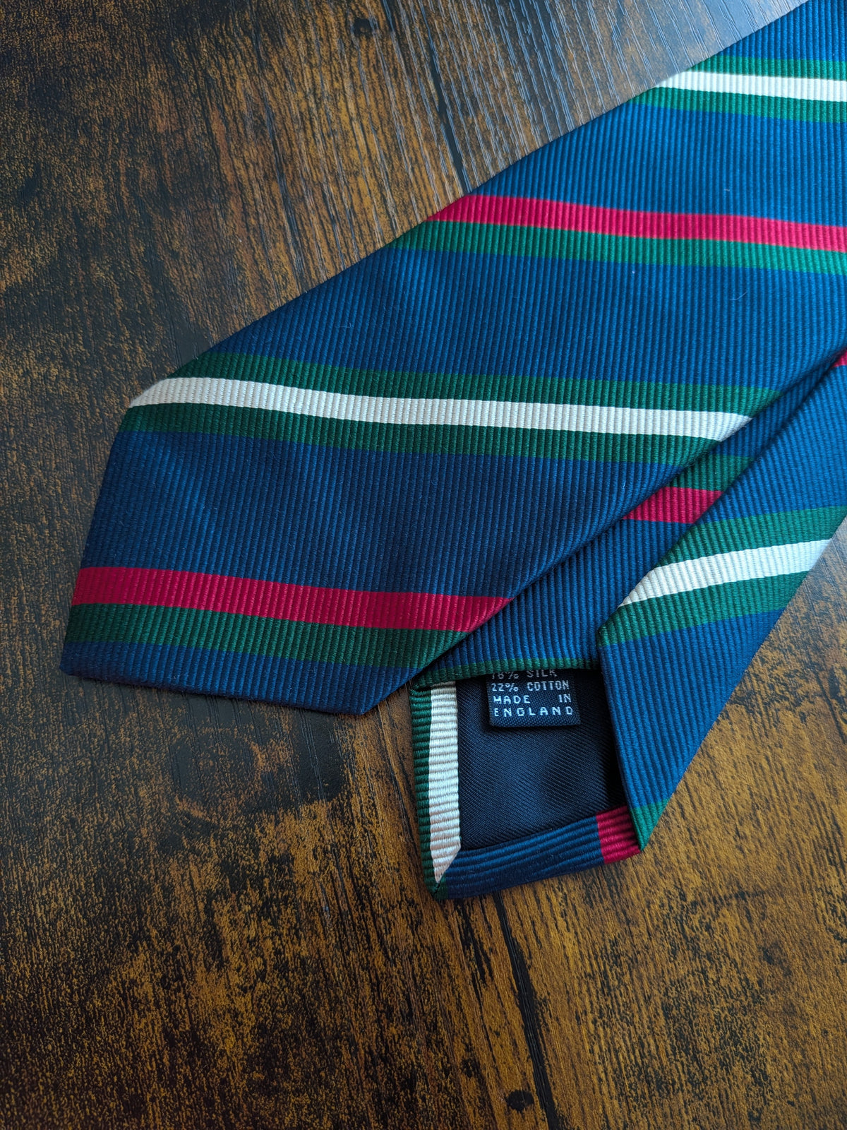 Drake's navy green white multicoloured striped handmade silk tie detail view 2