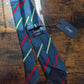 Drake's navy green white multicoloured striped handmade silk tie detail view 3