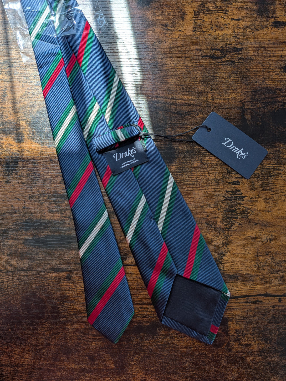 Drake's navy green white multicoloured striped handmade silk tie detail view 3