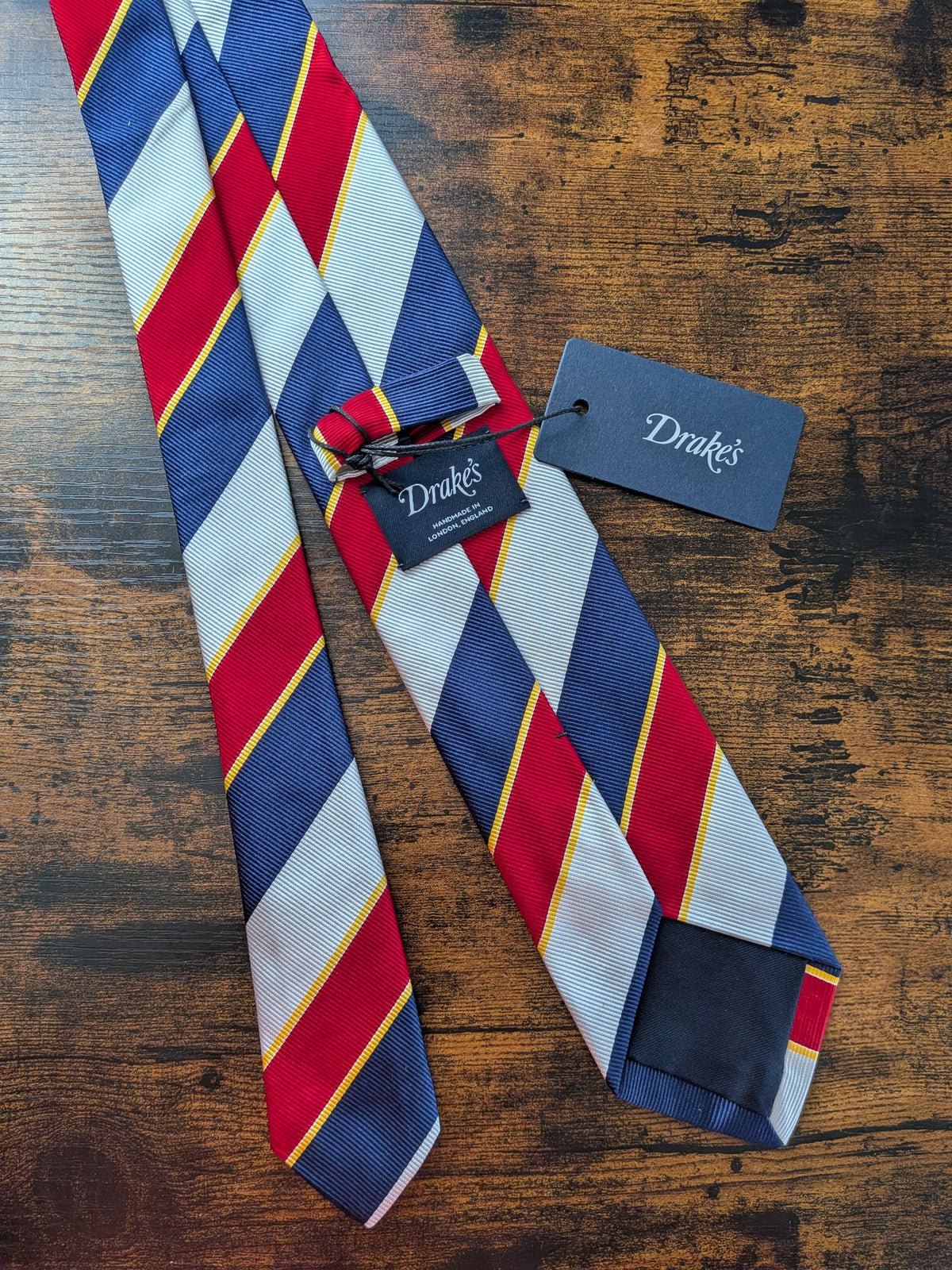 Drake's navy red multicoloured striped handmade silk tie detail view 2