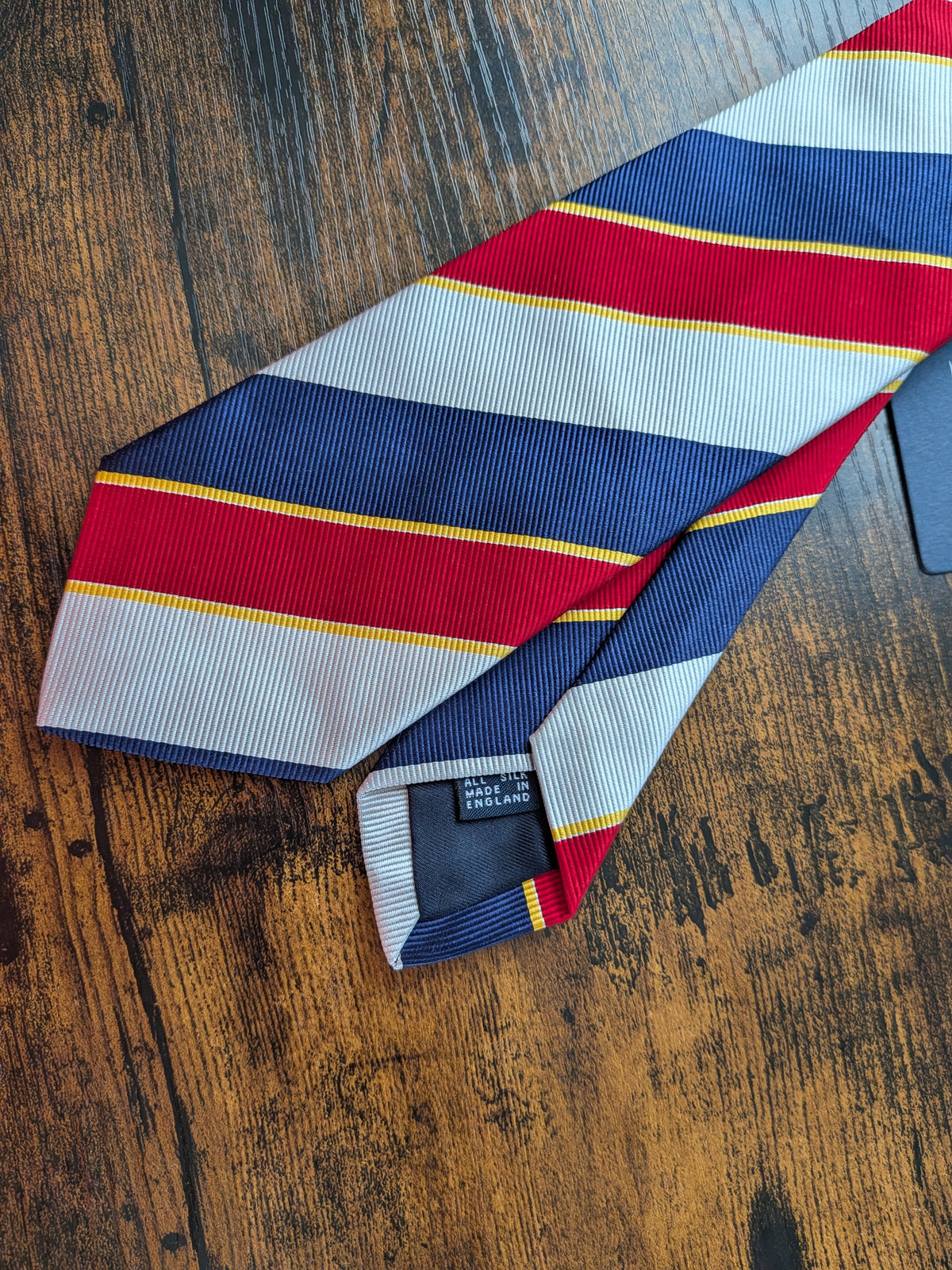 Drake's navy red multicoloured striped handmade silk tie detail view 3