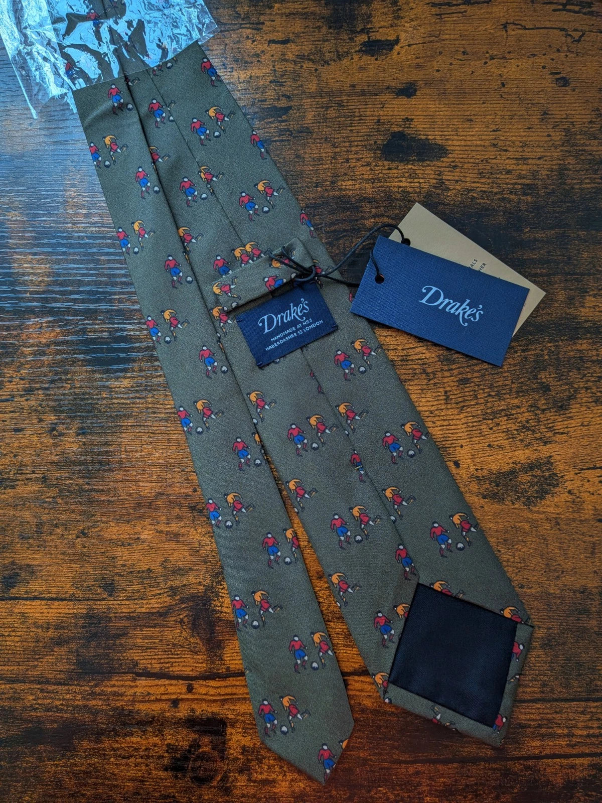 Drake's olive green football sport motif handmade tipped silk tie detail view 2