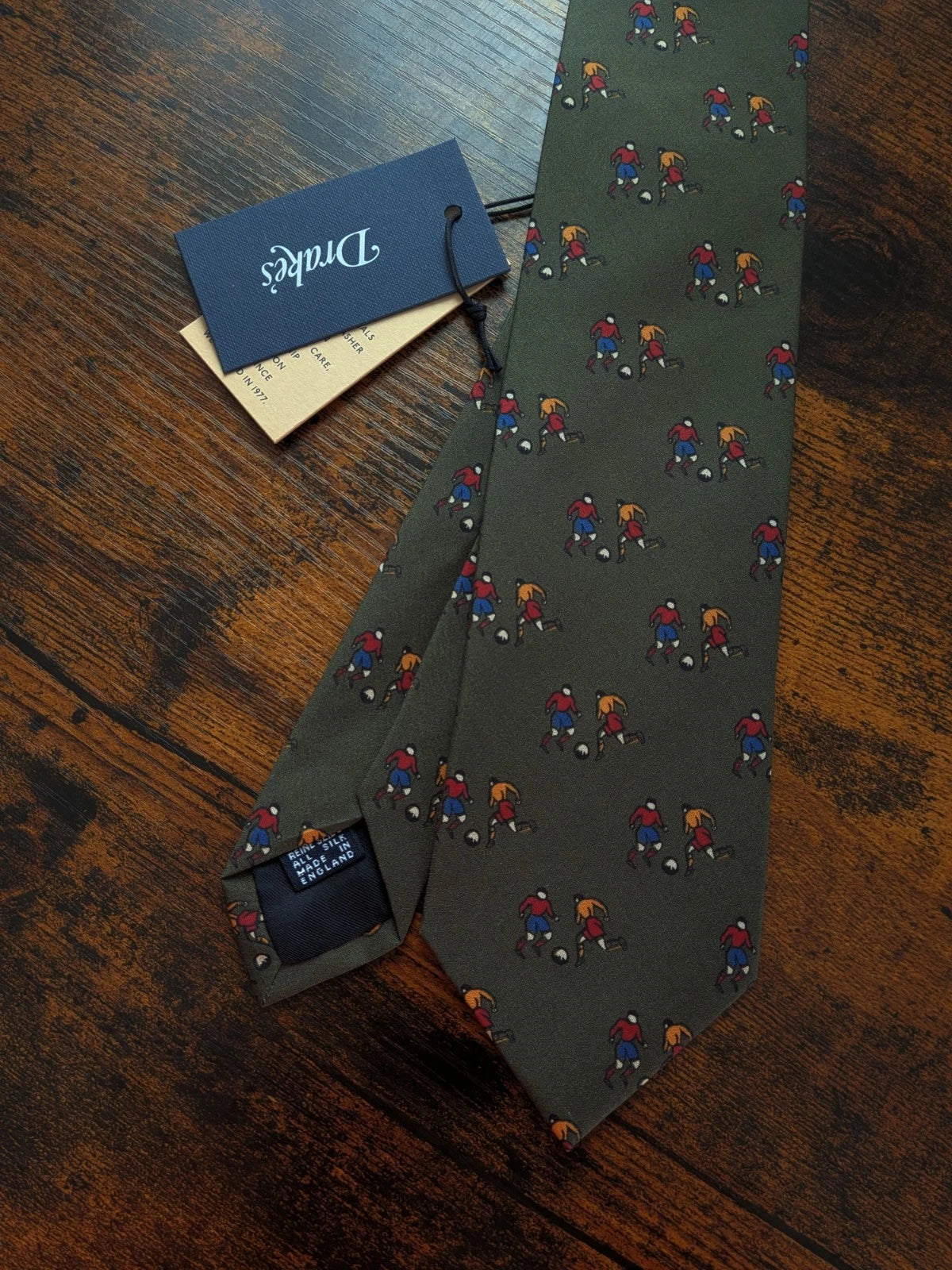 Drake's olive green football sport motif handmade tipped silk tie detail view 3