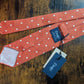 Drake's orange white handmade polka dot hand rolled silk tie detail view 3