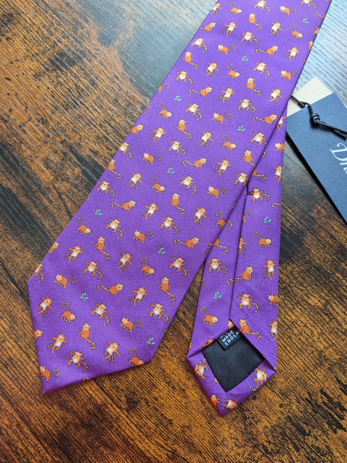 Drake's red panda motif handmade tipped silk tie detail view 2