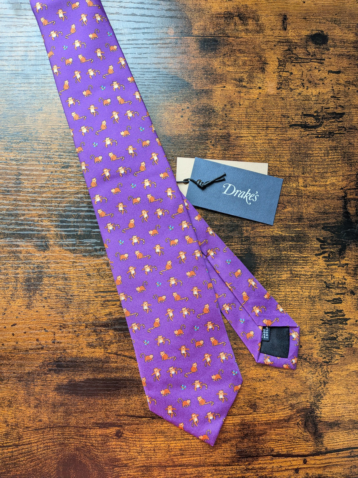 Drake's red panda motif handmade tipped silk tie detail view 3