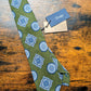 Drake's sage green blue geometric handmade silk tie detail view 2