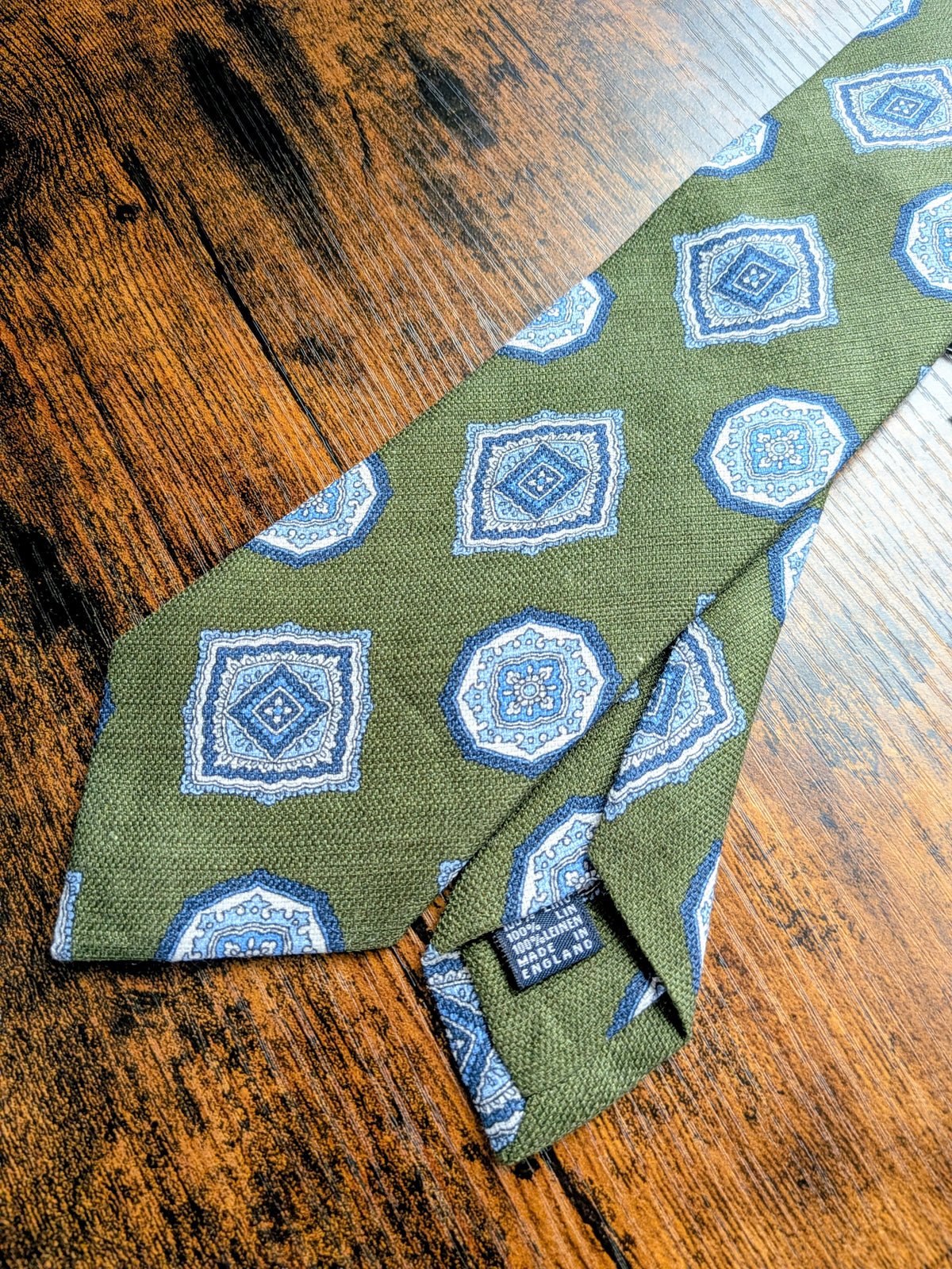Drake's sage green blue geometric handmade silk tie detail view 3