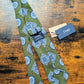 Drake's sage green blue geometric handmade silk tie detail view 4