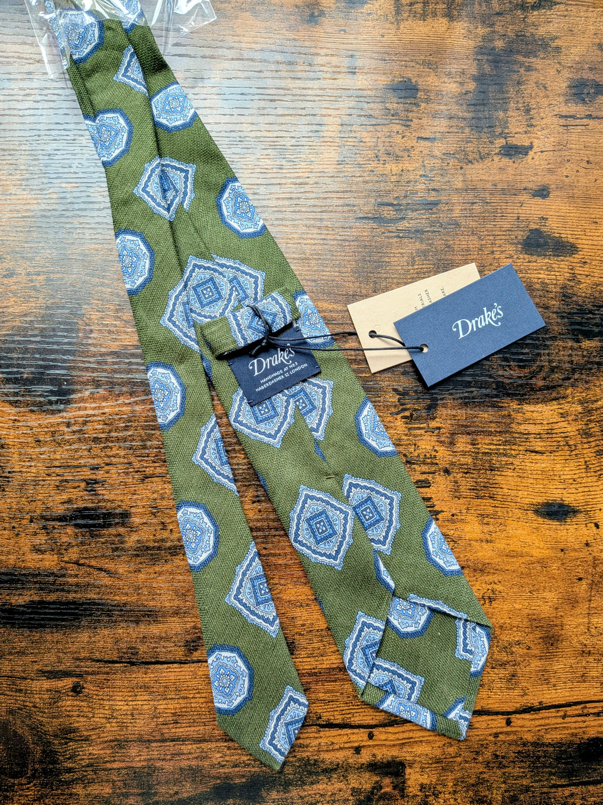 Drake's sage green blue geometric handmade silk tie detail view 4