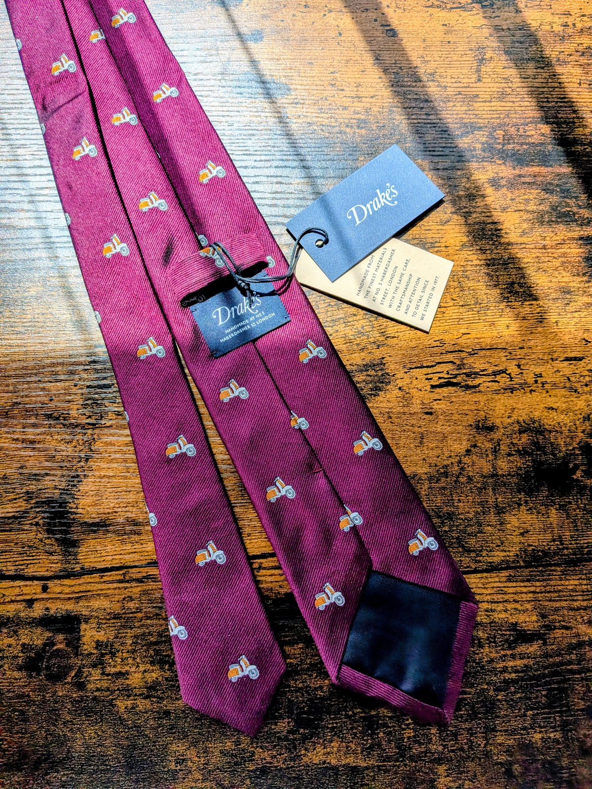 Drake's vespa motif handmade silk tie burgundy orange detail view 2